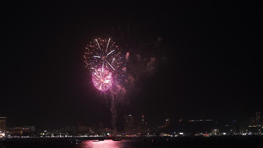 Fireworks shooting from the boat on the sea. | Shutterstock HD Video #1111800099