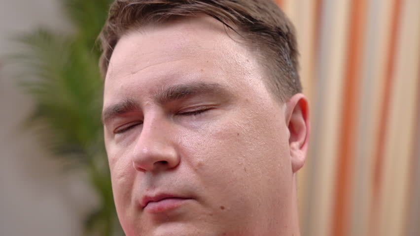 Man hostage with taped over mouth and slapped on face. Victim wakes up beginning to pant nervously heavenly from fear. Abducted man regains consciousness | Shutterstock HD Video #1111801031