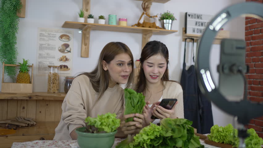 Pretty woman is livestreaming for sell healthy food. Vlogging and healthy lifestyle concept. | Shutterstock HD Video #1111802577