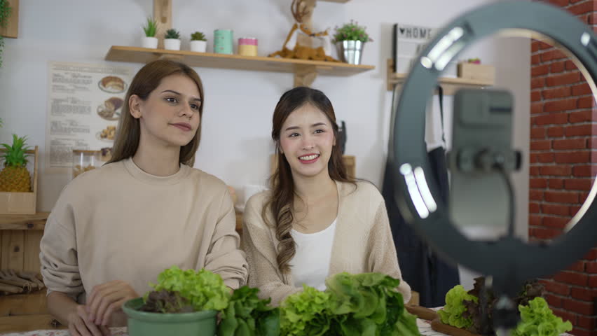 Pretty woman is livestreaming for sell healthy food. Vlogging and healthy lifestyle concept. | Shutterstock HD Video #1111802595