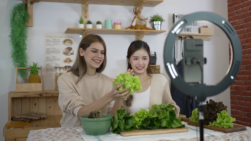 Pretty woman is livestreaming for sell healthy food. Vlogging and healthy lifestyle concept. | Shutterstock HD Video #1111802609