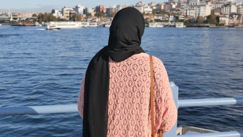 Unhappy girl standing at bench .