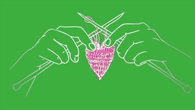 Loop cartoon video animation a hand knitting a heart on a green screen background