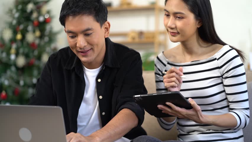 Elearning online working concept. Business people working on laptop computer, searching and taking note on paper notebook with pen working in home office. | Shutterstock HD Video #1111807289