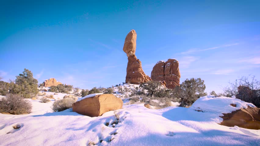 A natural balanced rock at the national park in winter in Utah
