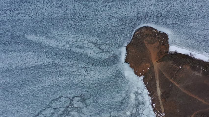 The first ice on the shore of Lake Baikal in autumn. View from above