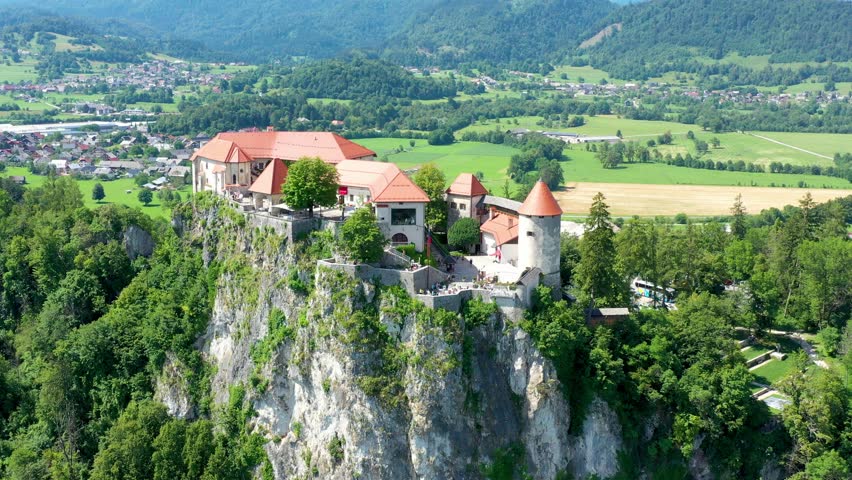 Bled, Slovenia, aerial view of beautiful Bled Castle (Blejski Grad) with Lake Bled (Blejsko Jezero), the Church of the Assumption of Maria on a bright summer day. Bled, Slovenia.