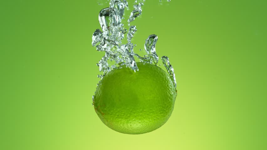 Super Slow Motion of Falling Whole Lime Into Water, Isolated on Green Background. Filmed on High Speed Cinema Camera, 1000 fps. | Shutterstock HD Video #1111825891