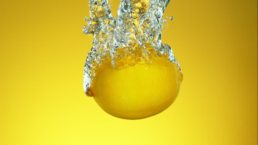 Super Slow Motion of Falling Whole Lemon Into Water, Isolated on Green Background. Filmed on High Speed Cinema Camera, 1000 fps. | Shutterstock HD Video #1111825911