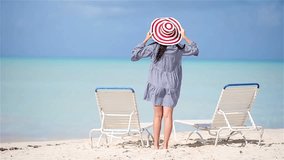 Coastal Elegance, Young Woman's Beauty on White Sand Beach, Experience coastal elegance as a young and beautiful woman graces the white sand tropical beach. Capture the serenity and beauty of her - Powered by Shutterstock - Get 15% off with code: PIKWIZARD15