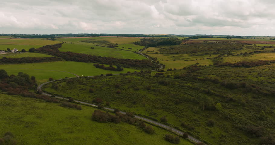 Bird's-eye view of car road through picturesque greenery of Mendip Hills in Somerset. | Shutterstock HD Video #1111836381