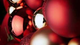 Colorful Christmas decoration. Christmas red and golden balls. Decorating Christmas tree. Happy New Year or Merry Christmas concept. Vertical video