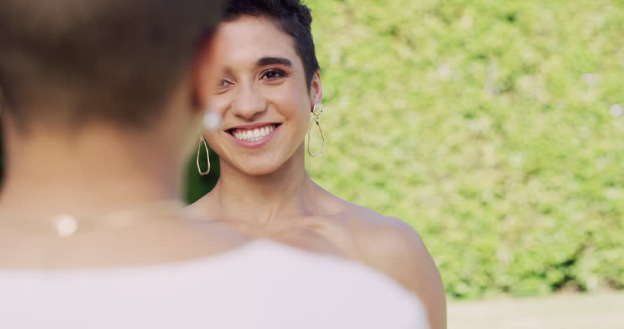 Wedding, lesbian and couple with happy for ceremony, commitment or unity outdoor with support. Lgbtq, women or queer for marriage, celebration or bride with smile, love and flowers at event in nature | Shutterstock HD Video #1111840287