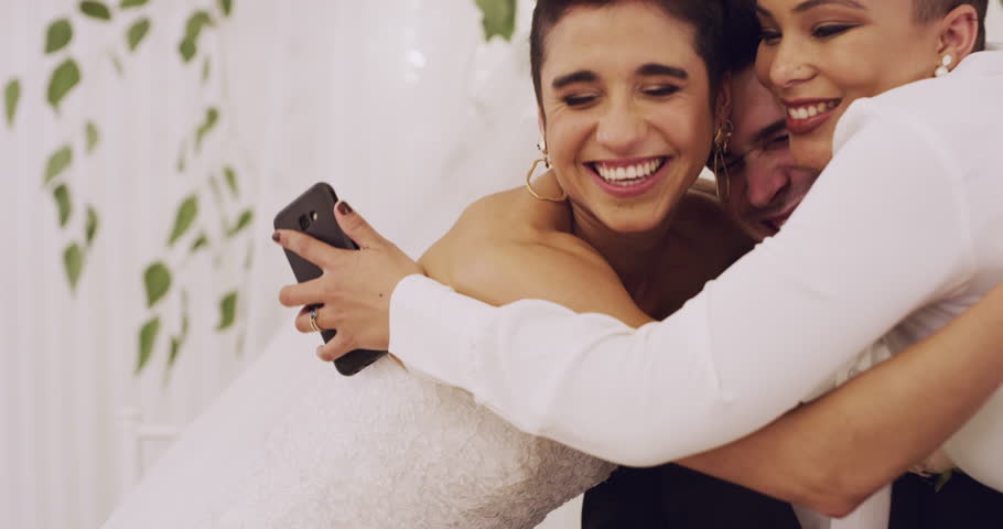 Wedding, congratulations and a woman hugging newlyweds at a marriage celebration of love or commitment. Friends, smile or happy with a guest embracing a married bride and groom at an event venue | Shutterstock HD Video #1111840303