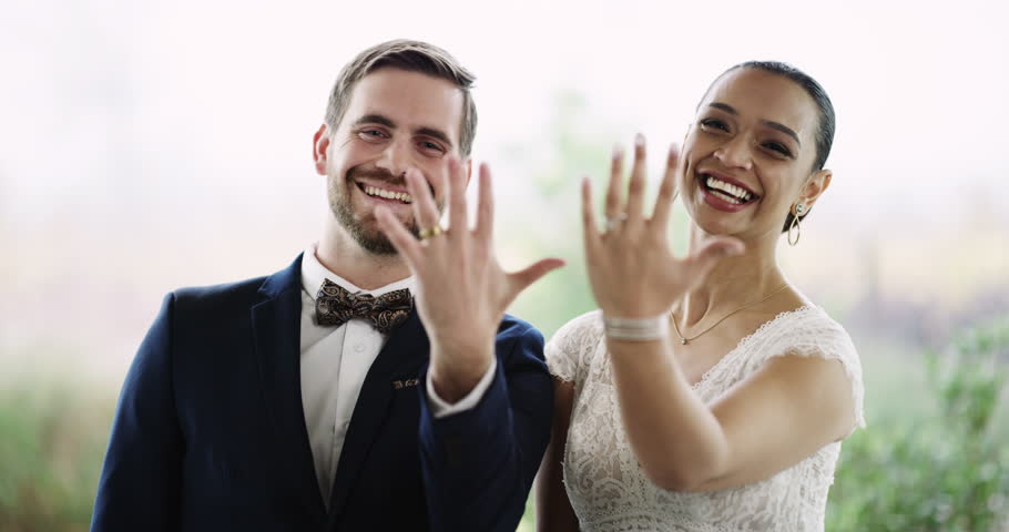 Couple, smile and wedding ring for commitment, love and outdoors or promise and loyalty in marriage. Newlyweds, jewelry and faith or trust in relationship, hope and partnership in portrait of support | Shutterstock HD Video #1111840351