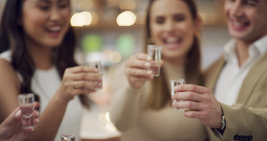 Party, hands and friends toast at a night club for celebration, fun or freedom, happy or excited. Clubbing, cheers and people at event with alcohol, drink or tequila , freedom or birthday reunion