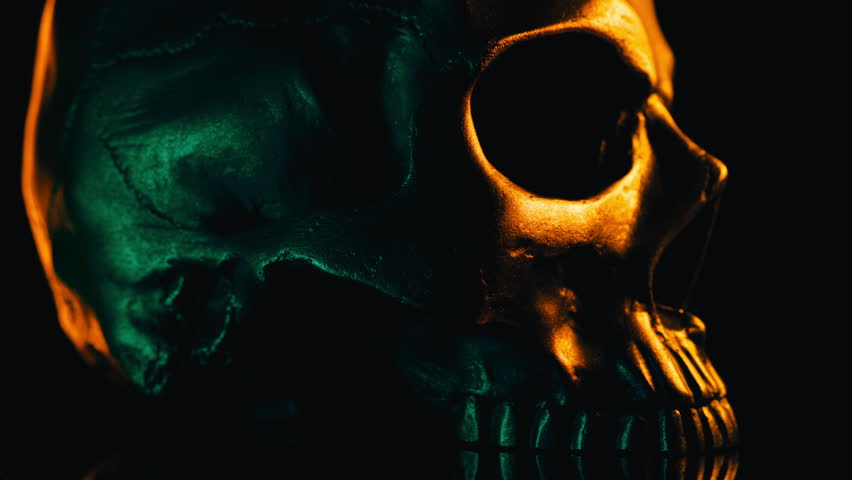 Bronze human skull rotates on black background. Exploring death, gothic theme. | Shutterstock HD Video #1111842257