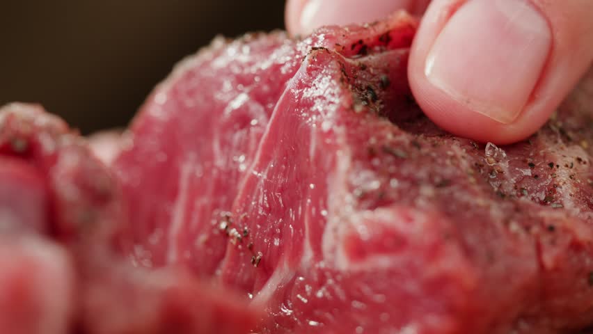 Man chef cooking beef steak angus close-up. Professional cheif preparing meat in restaurant kitchen. Delicious barbecue pork, spicy cuisine, american barbeque. | Shutterstock HD Video #1111842473