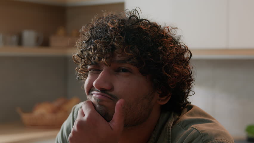 Pensive Hispanic man Indian hesitate pondering thoughtful male Arabian guy thinking idea problem solution puzzled confused unsure hesitation expression think remember solving brainstorm at kitchen Royalty-Free Stock Footage #1111847567