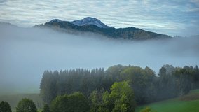 Timelapse of fog and mist dissipating in valley in the Alps, Germany - Powered by Shutterstock - Get 15% off with code: PIKWIZARD15