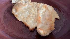 Video of milanesa cooking in a frying pan, Food preparation concept.