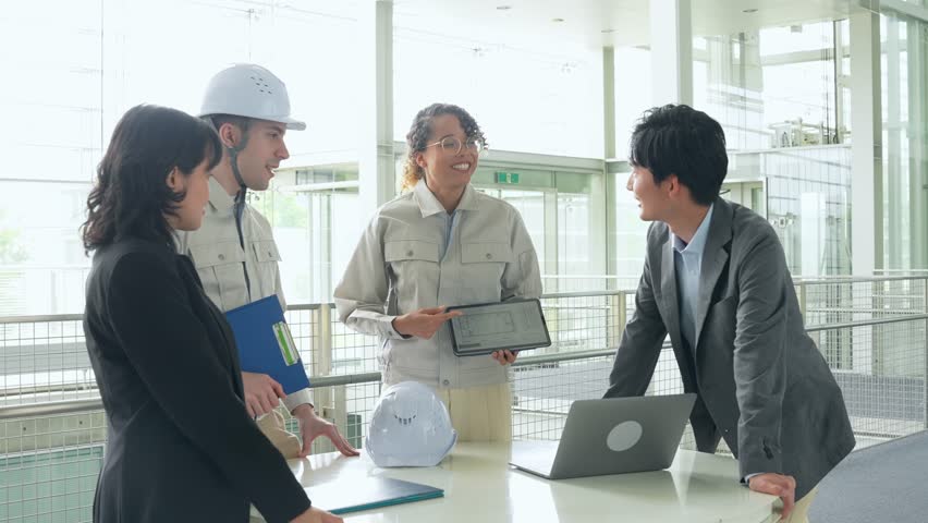 Group of multinational engineers and business people meeting in a building. International business. | Shutterstock HD Video #1111852025