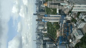 Vertical video. Aerial view of downtown and Lumpini Park in Bangkok, Thailand. 