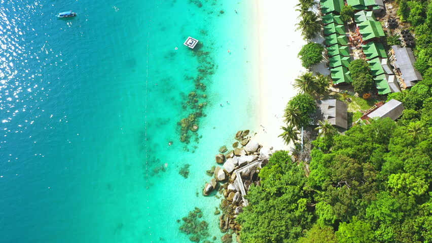 Beach, coastal and town on drone for tropical adventure, sea trip travel or summer nature. Ocean, water for holiday journey or outdoor waves in Perhential Islands, Malaysia in sun environment resort