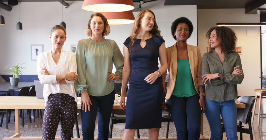 Portrait of happy diverse businesswomen standing in office smiling to camera, in slow motion. Business, teamwork, confidence and work. | Shutterstock HD Video #1111859711