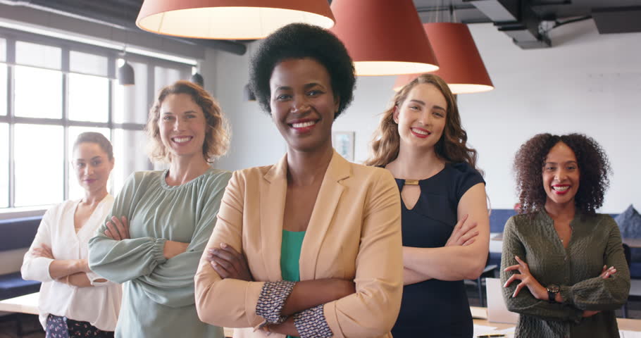 Portrait of happy diverse businesswomen standing in office with arms crossed smiling, in slow motion. Business, teamwork, confidence and work. | Shutterstock HD Video #1111859809