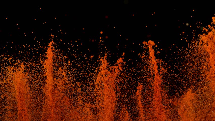 Super Slow Motion Shot of Dried Red Pepper Powder Explosion Isolated on Black Background at 1000fps.