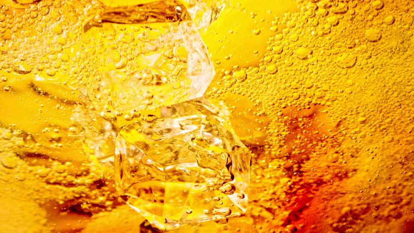 Super Slow Motion Shot of Ice Cubes Falling into Lemonade at 1000fps.