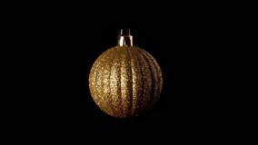 Golden Christmas ball isolate rotate 360 isolated on black background slow motion video