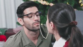 young couple shares spaghetti during romantic Christmas dinner - Powered by Shutterstock - Get 15% off with code: PIKWIZARD15