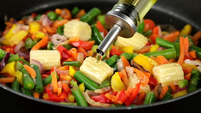 Pouring oil for cooking vegetables in pan. Healthy food, vegetarian cuisine | Shutterstock HD Video #1111876217