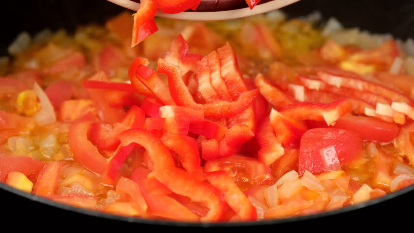 Chopped red bell pepper add in frying pan with to tomatoes | Shutterstock HD Video #1111876501