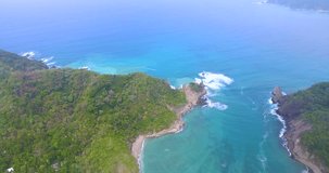 Aerial footage flying over an inlet between islands in Costa Rica's Tortuga Islands archipelago during summer
