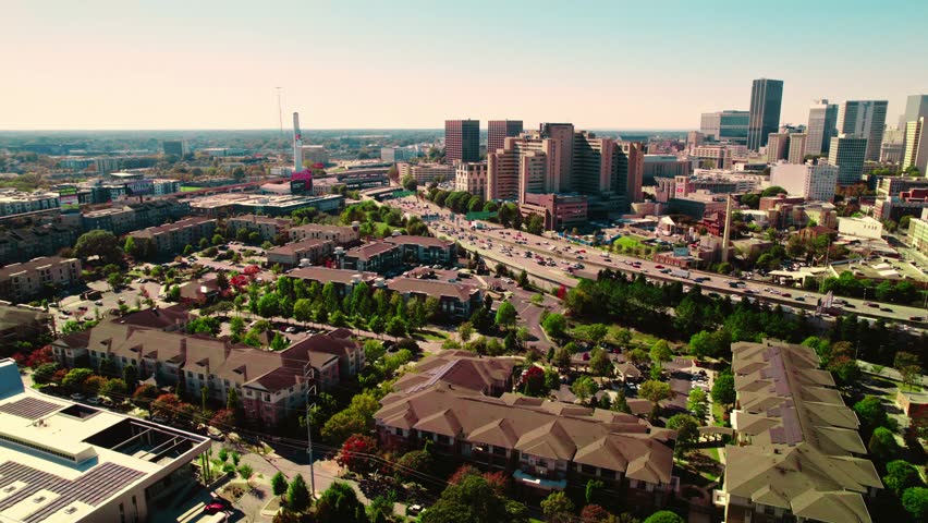 Aerial of Atlanta, Georgia the houses, highway and the skyscrapers in the background.