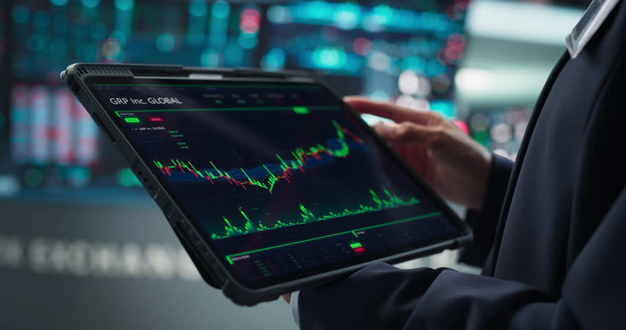 Close Up on a Tablet Computer Screen with Real-Time Stock Market Analytics, Graphs and Reports. Stock Exchange Software Template. Broker Monitoring Financial and Business Opportunities at Work Royalty-Free Stock Footage #1111884165