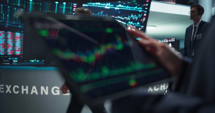 Close Up Footage of a Tablet Computer Monitor Screen with Real-Time Stocks, Commodities, Exchange Market Charts with Tickers on Display in a Financial Business Office Royalty-Free Stock Footage #1111884167