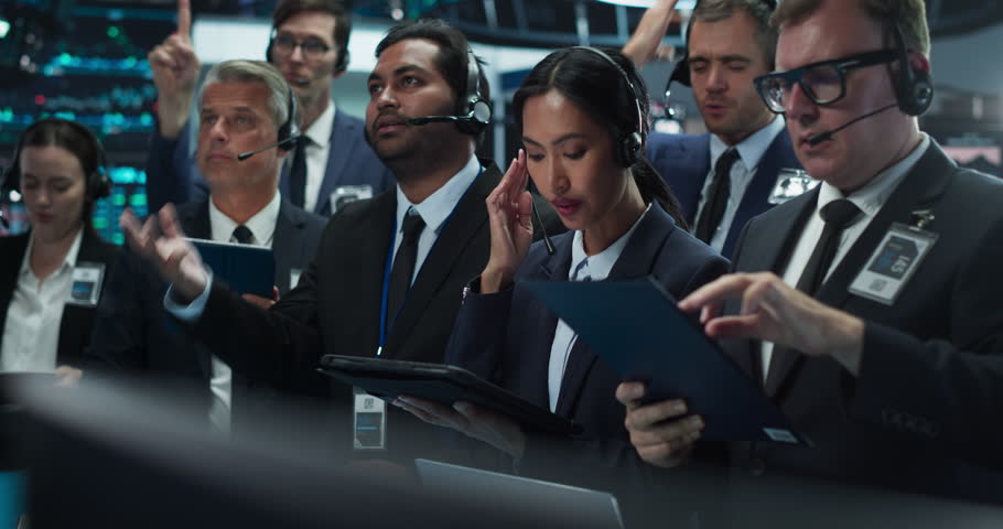 Portrait of Professional Traders Working on a Stock Exchange. Enthusiastic Men and Women Shouting, Signaling Orders for Company Shares and Commodities to Brokers at an Open Outcry Arbitrage | Shutterstock HD Video #1111884397