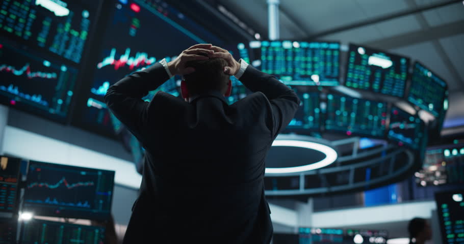 Stressed Stock Exchange Trader Can't Apprehend a Sudden Stock Market Collapse. Financial Crisis Concept with Stock Broker Saddened by Negative Ticker Information, Red Graphs and Real-Time Data
