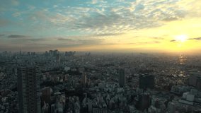 TOKYO, JAPAN : Aerial high angle view of CITYSCAPE of TOKYO in sunset. View of buildings around Shinjuku and Ikebukuro area. Japanese city life, business and urban metropolis concept video.