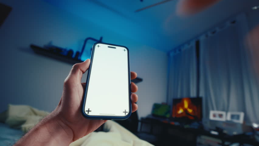 Person perspective laying in bed using smartphone at night swipe up on touchscreen. POV shot people use technology. 