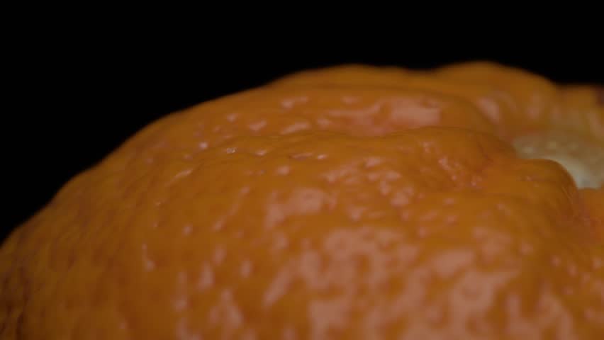 Macro View of Tangerine Peel texture. Close-up perspective capturing the detailed rotation of a tangerine peel.
 | Shutterstock HD Video #1111886821
