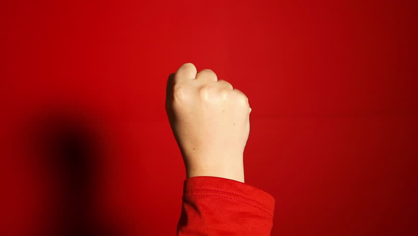 Woman's hands with fist gesture front and back side, on a red background. Alpha. Protest.. Power of teamwork and Competition concept. High quality FullHD footage Royalty-Free Stock Footage #1111887365