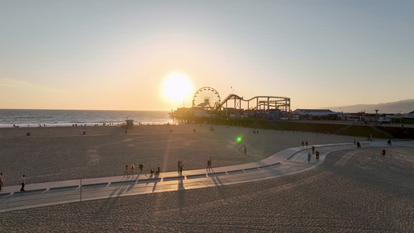 Santa Monica Pier At Los Angeles California United States. Amusement Park Los Angeles California. Sunset Film Beach Bay Water. Sunset Outdoors Beach Aerial Tour. Sunset Bay Water Ocean Sea. Royalty-Free Stock Footage #1111894305