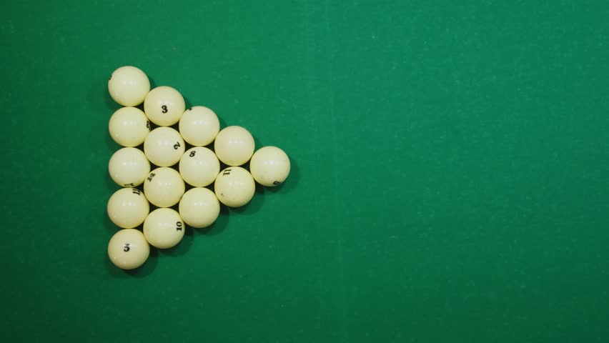 Breaking white pool balls top view on green billiards table for start to play. Russian biliard game, Russian pyramid. Billiard balls with numbers on a pool table. Billiards team sport. | Shutterstock HD Video #1111894823