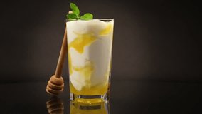prepared homemade yogurt with natural honey in a glass