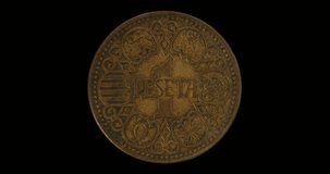 Reverse of Spain coin 1 peseta 1944, isolated in black background. Loopable animation in 4k resolution video.